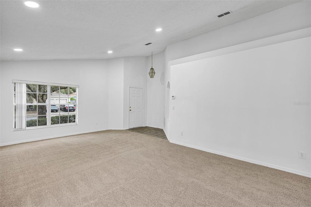 4254 Northern Dancer Way Orlando, FL 32826 - Photo 4 of 38 a view of an empty room with a window
