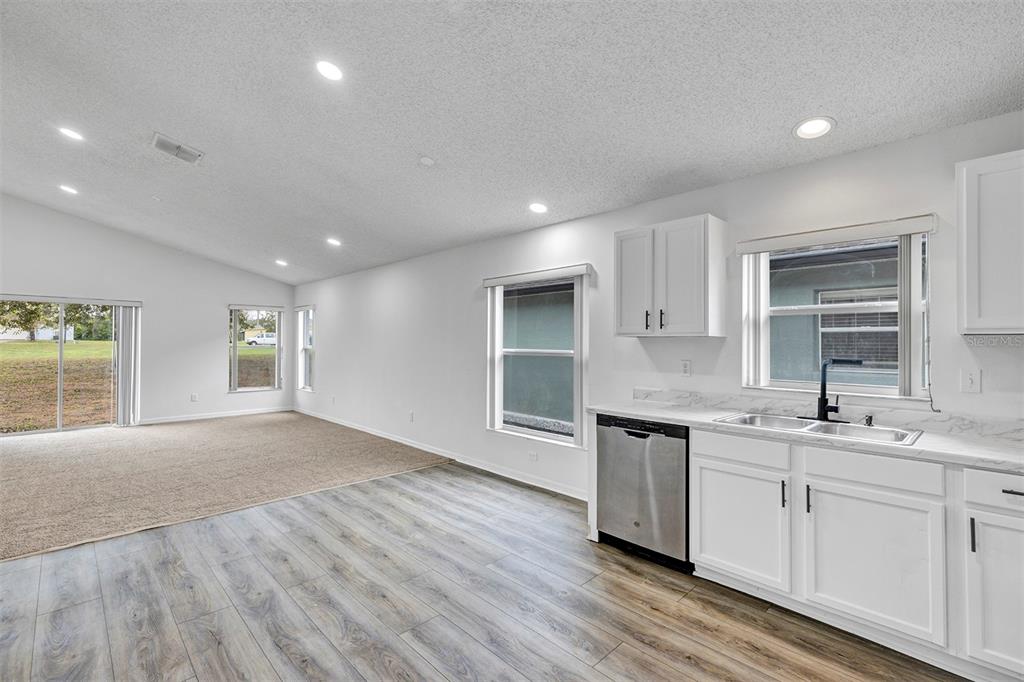 4254 Northern Dancer Way Orlando, FL 32826 - Photo 10 of 38 a view of a kitchen counter space and wooden floor
