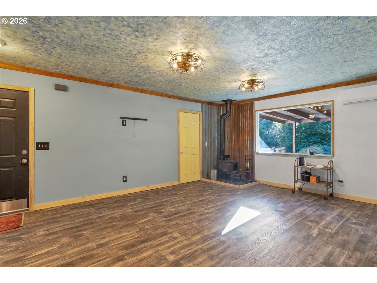 566 North Bear Creek Road Otis, OR 97368 - Photo 16 of 40 a view of an empty room with a window