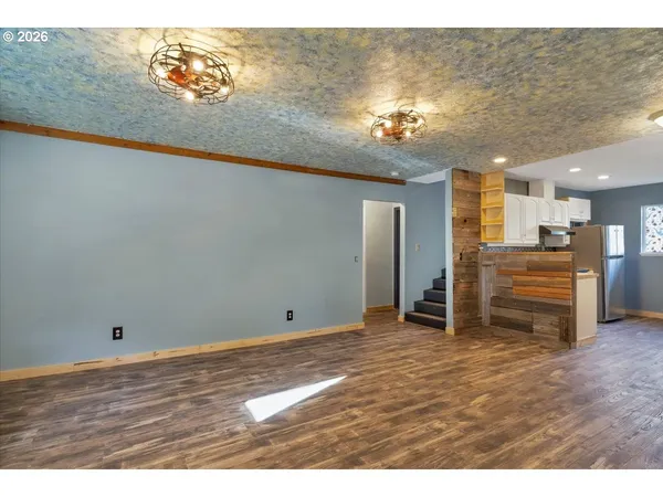 a view of a livingroom with a kitchen