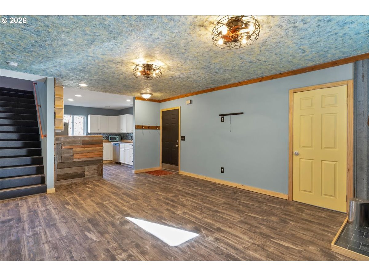 566 North Bear Creek Road Otis, OR 97368 - Photo 19 of 40 a view of a livingroom with a kitchen