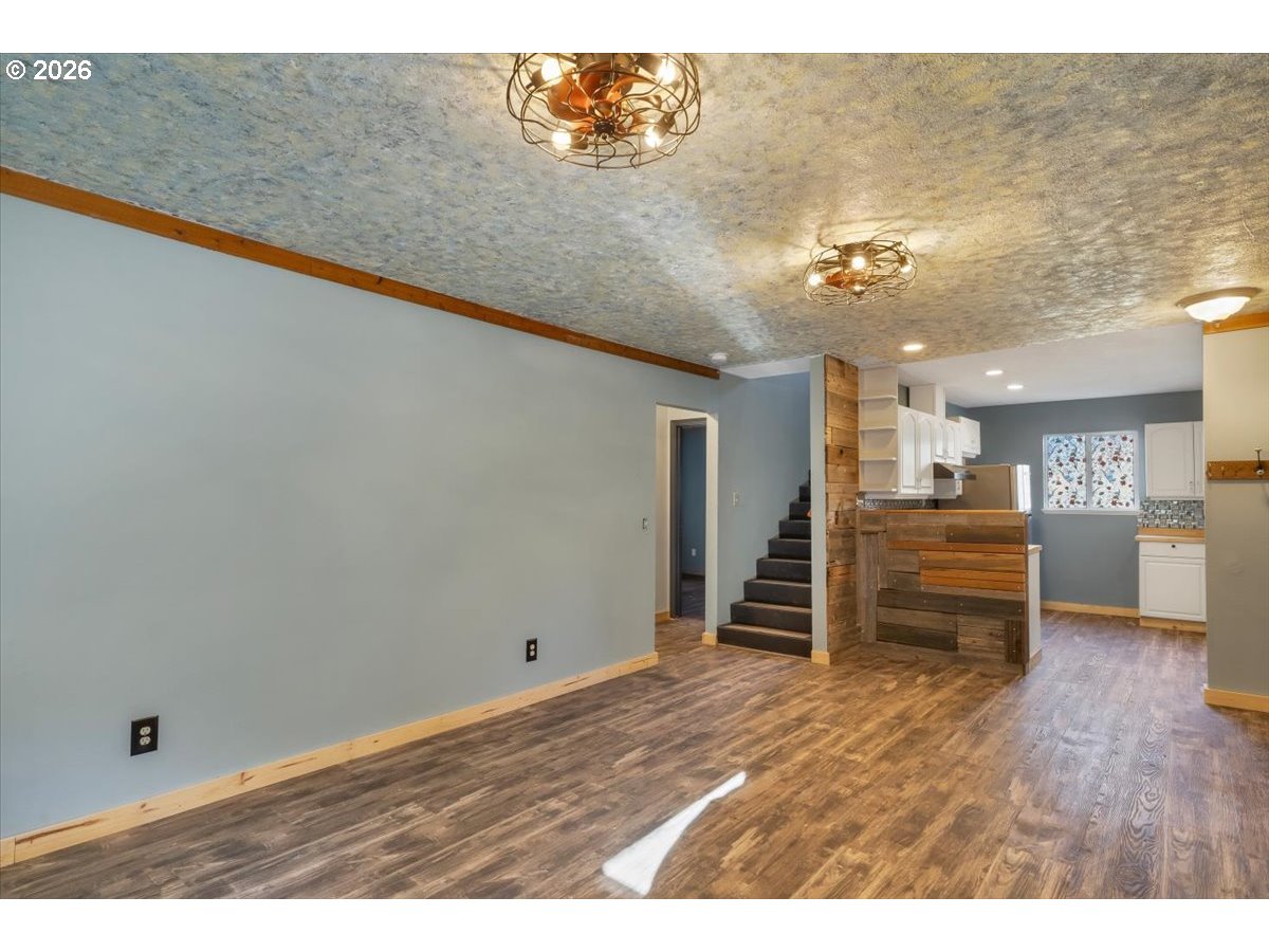 566 North Bear Creek Road Otis, OR 97368 - Photo 20 of 40 a view of empty room with wooden floor