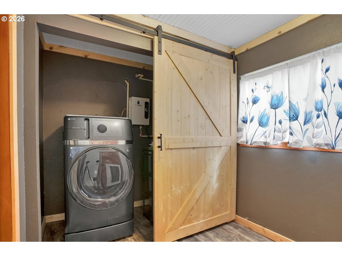 566 North Bear Creek Road Otis, OR 97368 - Photo 21 of 40 a view of washer and dryer