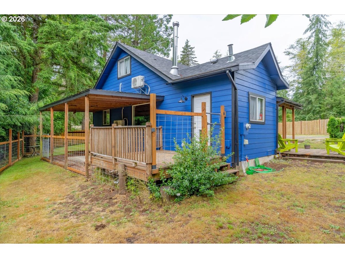 566 North Bear Creek Road Otis, OR 97368 - Photo 24 of 40 a front view of a house with garden