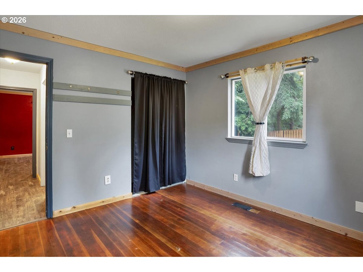 566 North Bear Creek Road Otis, OR 97368 - Photo 29 of 40 wooden floor in an empty room with a window