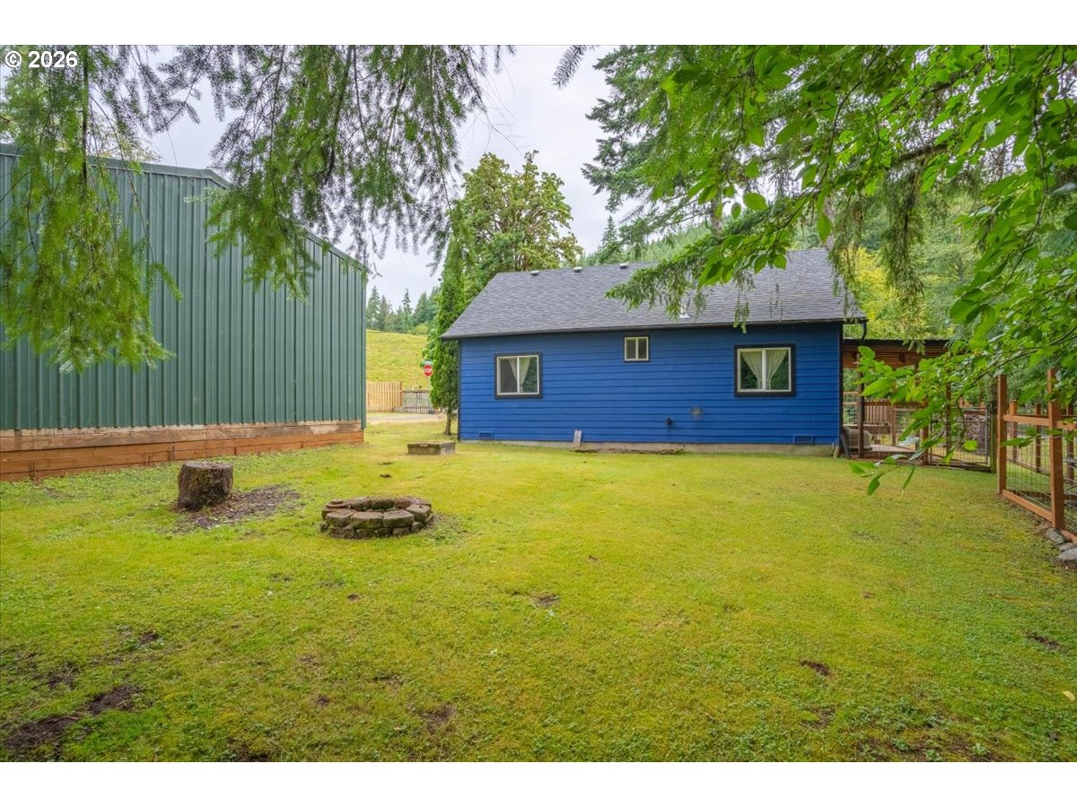 566 North Bear Creek Road Otis, OR 97368 - Photo 35 of 40 a front view of a house with yard