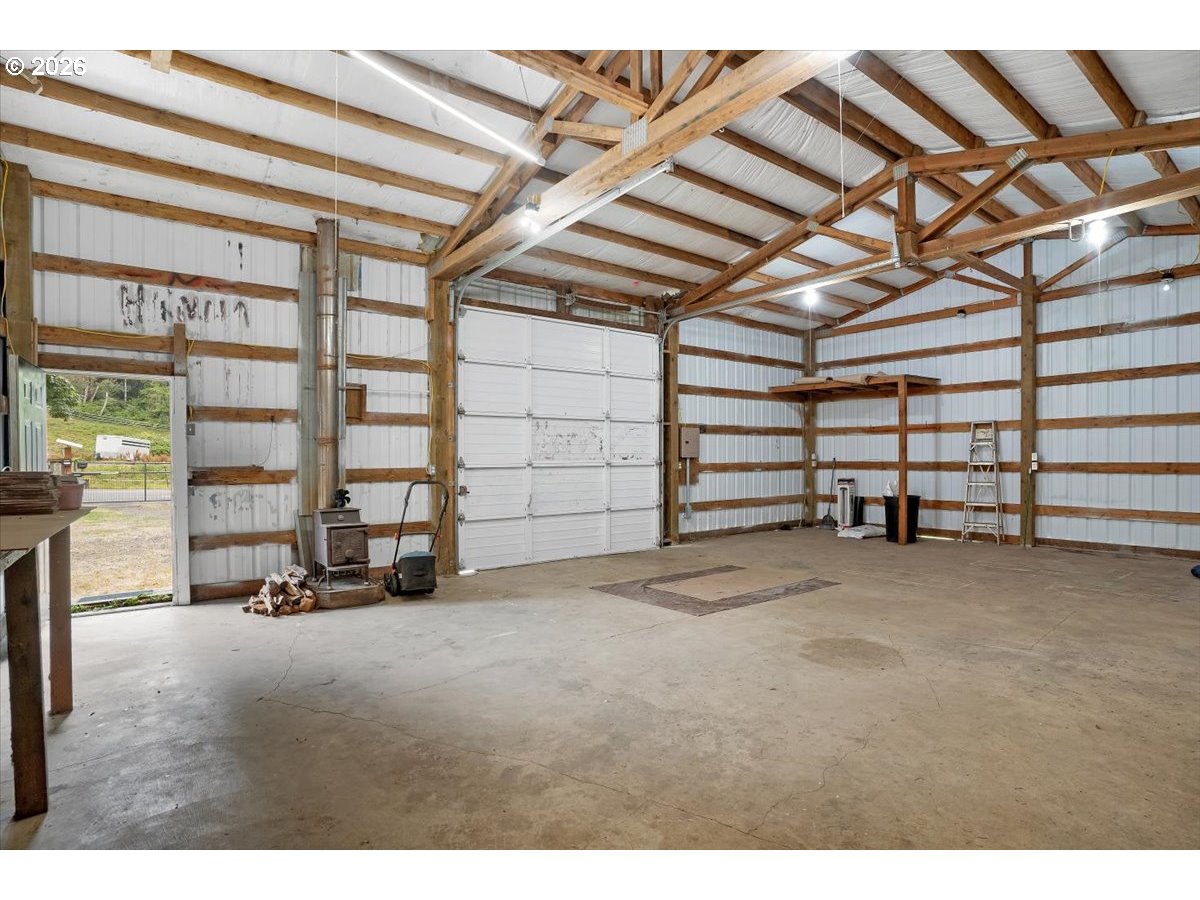 566 North Bear Creek Road Otis, OR 97368 - Photo 36 of 40 a view of an empty room with a balcony