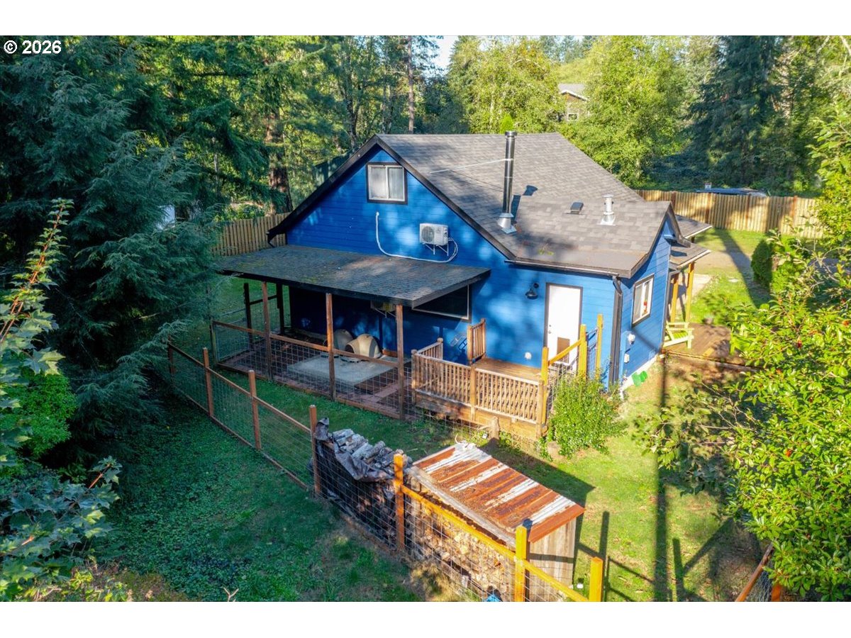 566 North Bear Creek Road Otis, OR 97368 - Photo 39 of 40 a front view of a house with garden
