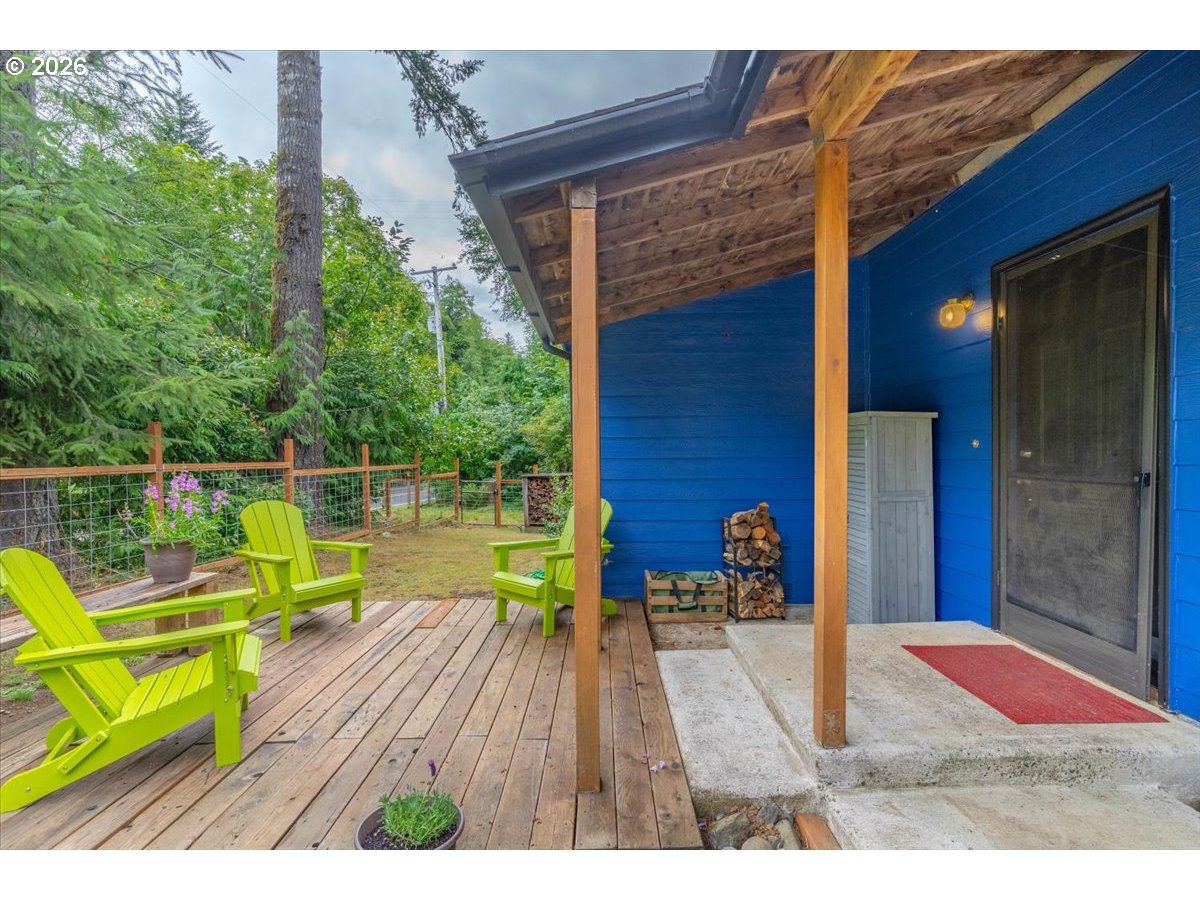 566 North Bear Creek Road Otis, OR 97368 - Photo 9 of 40 a view of house with wooden floor outdoor seating area