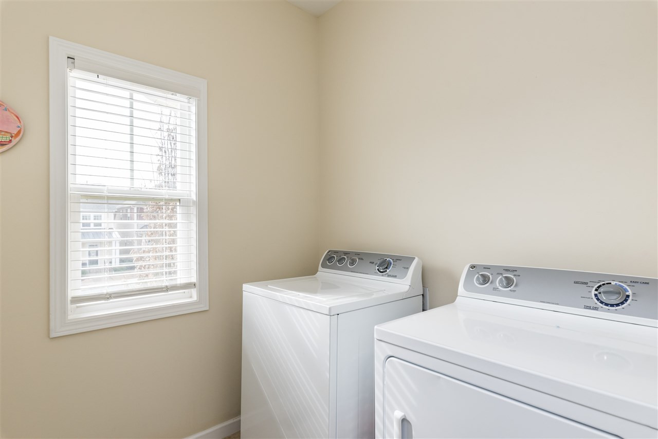 1413 Van Page Boulevard Raleigh, NC 27607 - Photo 19 of 25 LAUNDRY ROOM WITH NATURAL LIGHT UPSTAIRS. LAUNDRY ROOM