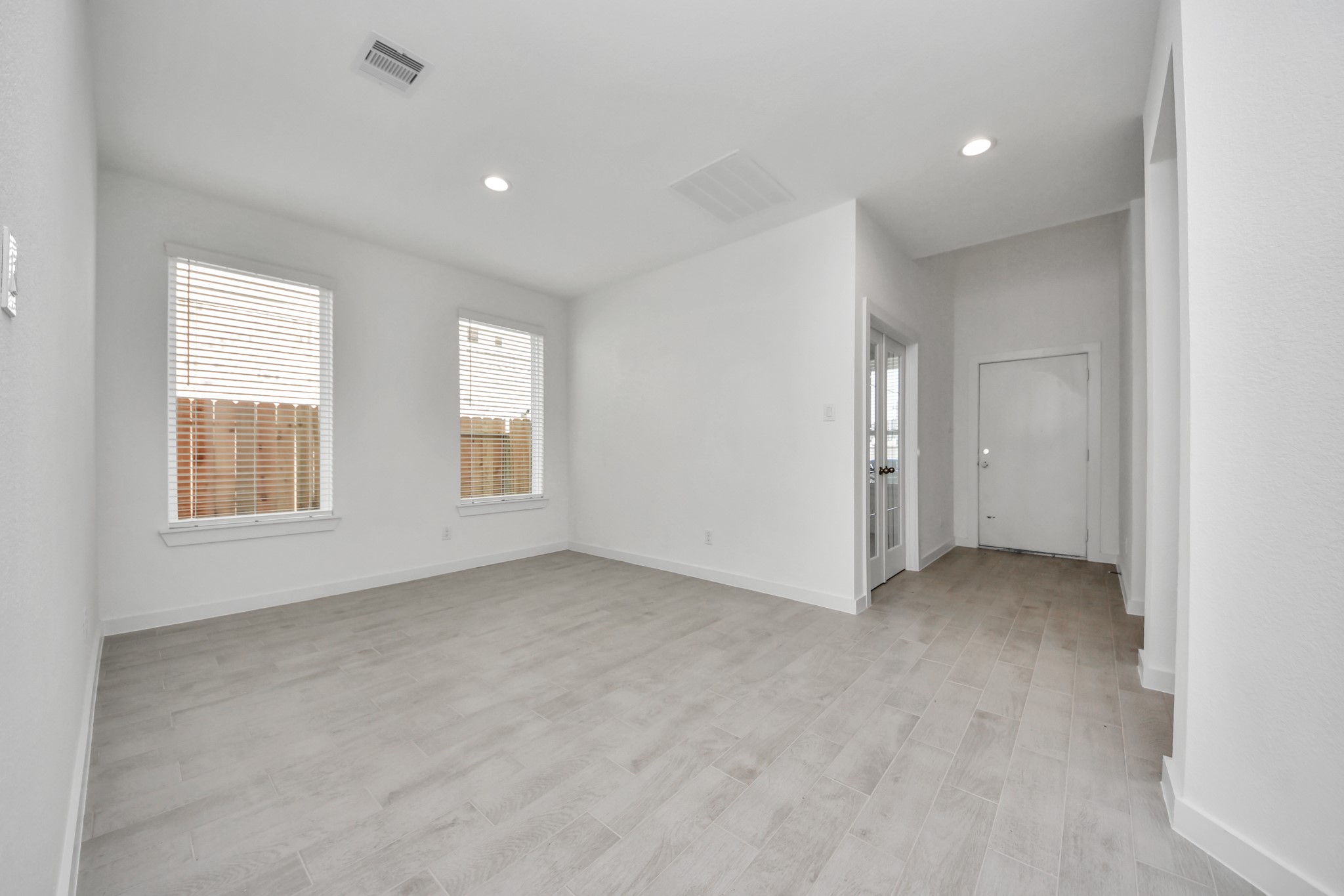2926 Bury Park Dr Spring Spring, TX 77373 - Photo 9 of 40 Make memories gathered around the table with your family and friends! This spacious dining room features elegant flooring, custom paint, and adjacent to family room and kitchen for open concept feel.