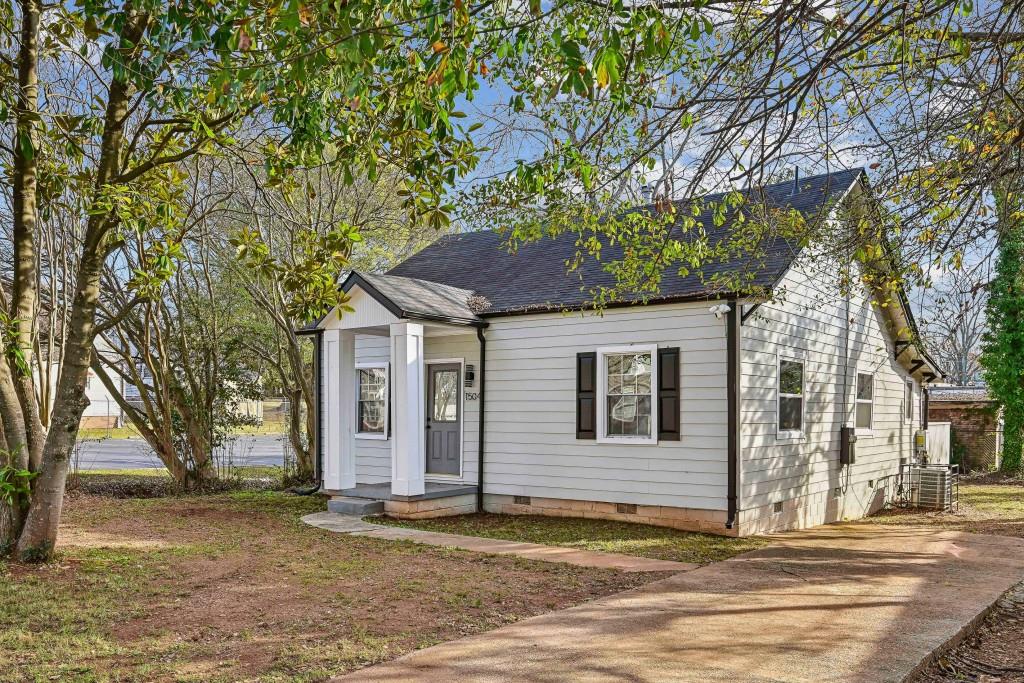 1504 Hardin Avenue Atlanta, GA 30337 - Photo 2 of 50 a house that has a tree in front of it