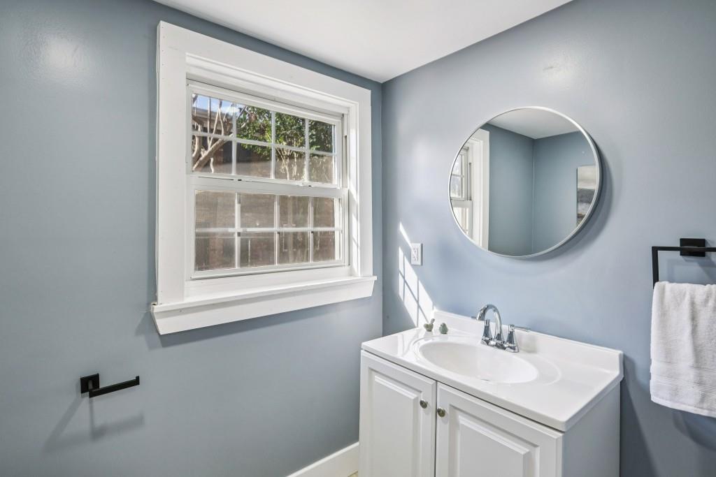 1504 Hardin Avenue Atlanta, GA 30337 - Photo 24 of 50 a bathroom with a sink and a mirror