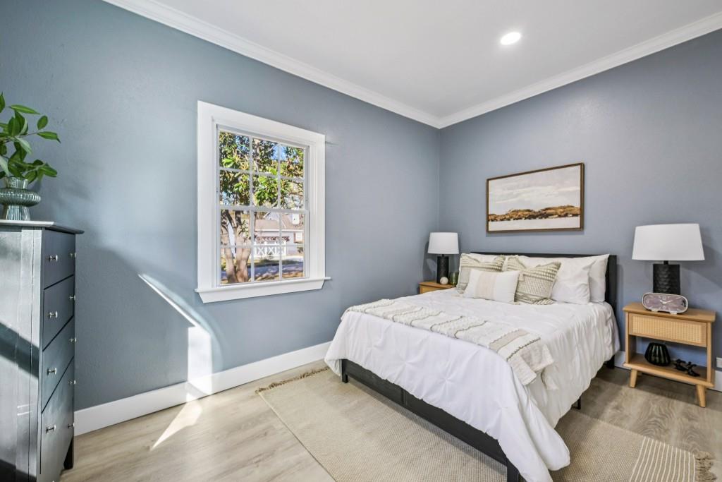 1504 Hardin Avenue Atlanta, GA 30337 - Photo 29 of 50 a bedroom with a bed painting on wall and a large window