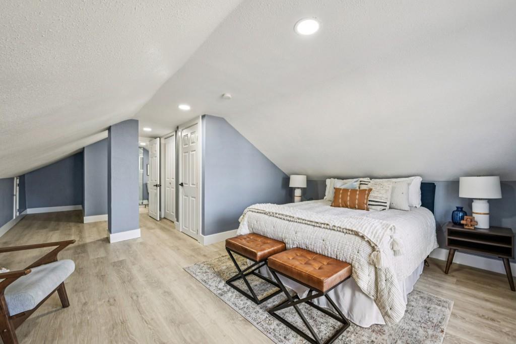 1504 Hardin Avenue Atlanta, GA 30337 - Photo 36 of 50 a spacious bedroom with a bed and a lamp on table