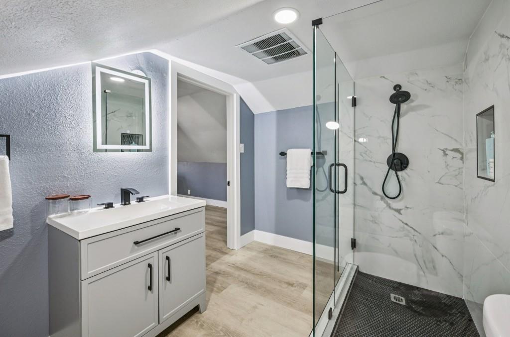 1504 Hardin Avenue Atlanta, GA 30337 - Photo 40 of 50 a bathroom with a sink vanity and a mirror