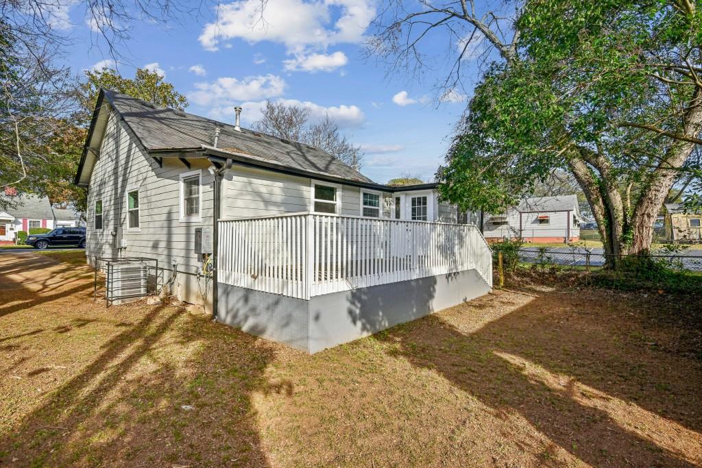1504 Hardin Avenue Atlanta, GA 30337 - Photo 43 of 50 a view of a house with a yard and sitting area