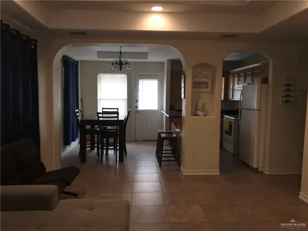a view of a livingroom with furniture and a window