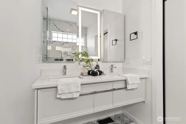 a bathroom with a sink and a mirror
