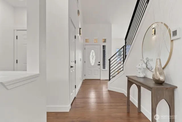 a view of front door with wooden floor