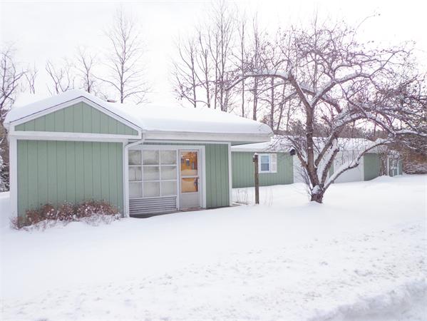 58 Stafford Road Monson, MA 01057 - Photo 1 of 26 a front view of a house with a yard covered in snow