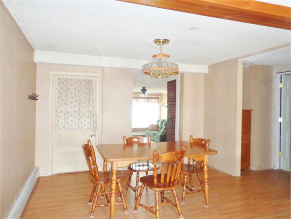 58 Stafford Road Monson, MA 01057 - Photo 12 of 26 a view of a dining room with furniture and wooden floor