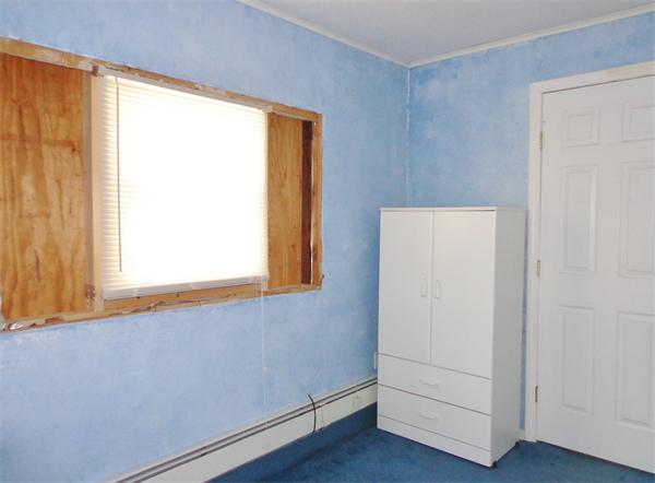 58 Stafford Road Monson, MA 01057 - Photo 17 of 26 a view of an empty room with wooden floor and a window