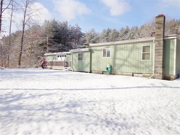 58 Stafford Road Monson, MA 01057 - Photo 23 of 26 a view of a house with snow on the road