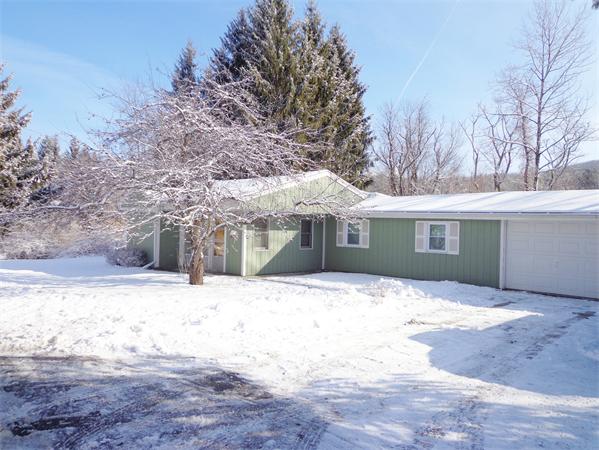 58 Stafford Road Monson, MA 01057 - Photo 24 of 26 a front view of a house with a yard covered in snow
