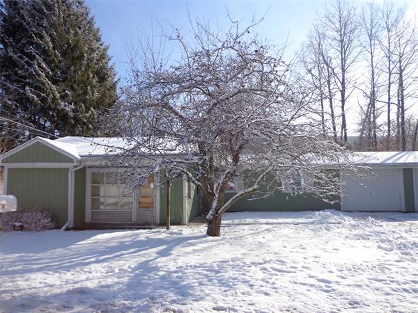 58 Stafford Road Monson, MA 01057 - Photo 26 of 26 a front view of a house with a yard and garage