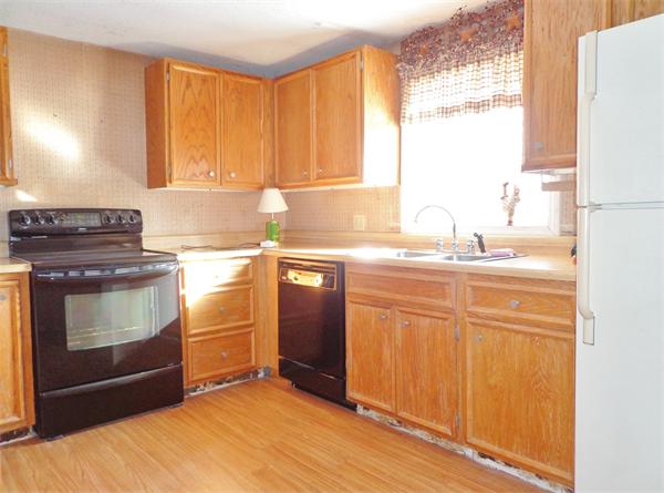 58 Stafford Road Monson, MA 01057 - Photo 3 of 26 a kitchen with a stove a sink and a window