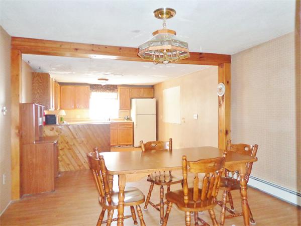 58 Stafford Road Monson, MA 01057 - Photo 4 of 26 a view of a dining room with furniture and wooden floor
