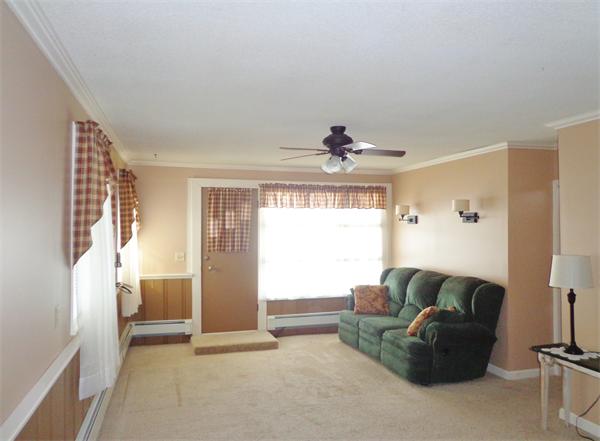 58 Stafford Road Monson, MA 01057 - Photo 5 of 26 a living room with furniture and a large window