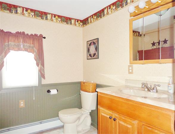 58 Stafford Road Monson, MA 01057 - Photo 7 of 26 a bathroom with a toilet sink and mirror