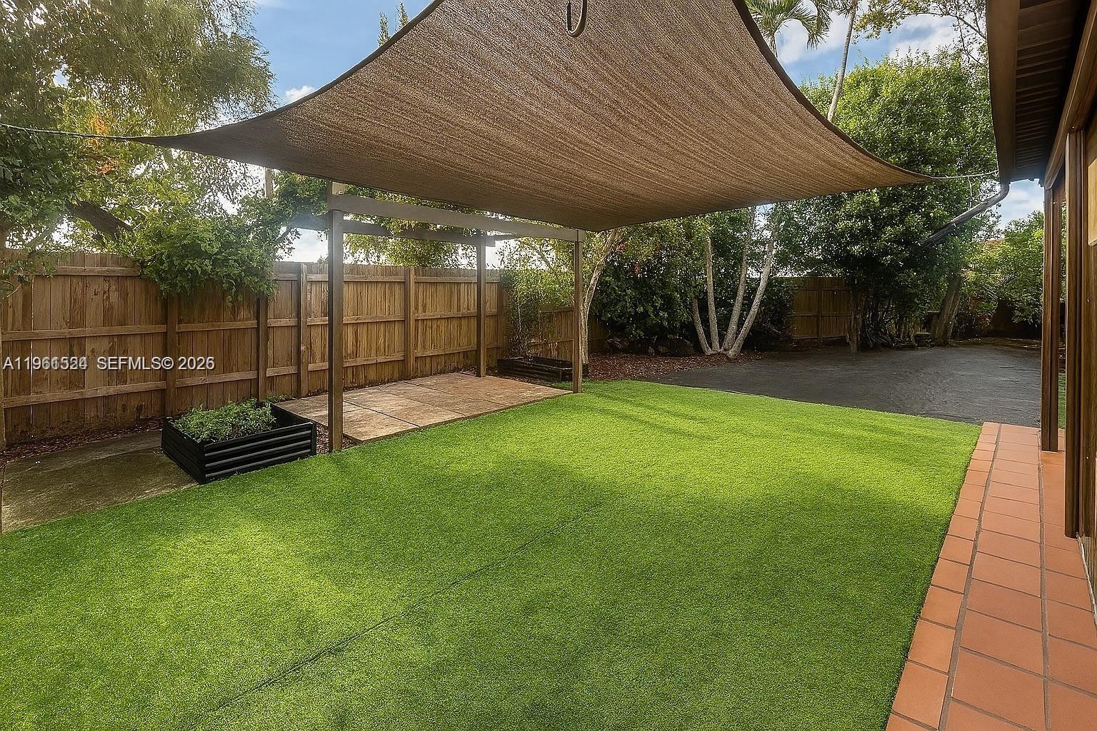 3250 Southwest 116th Place Miami, FL 33165 - Photo 12 of 15 a view of a backyard