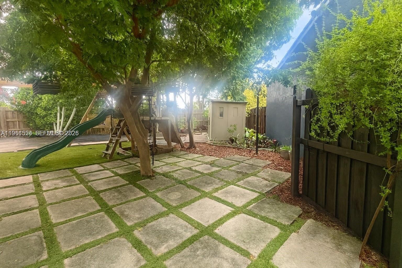 3250 Southwest 116th Place Miami, FL 33165 - Photo 14 of 15 a view of a backyard of the house