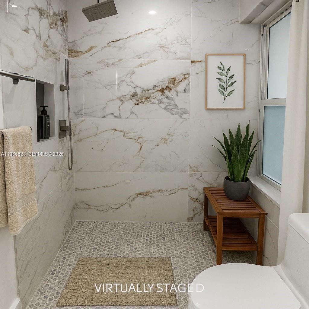 3250 Southwest 116th Place Miami, FL 33165 - Photo 8 of 15 a bathroom with a toilet and a shower