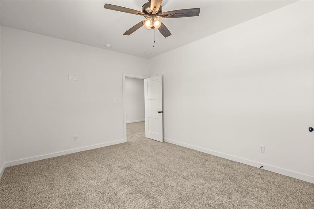 177 Hulen Circle Aledo, TX 76008 - Photo 17 of 21 an empty room with chandelier fan