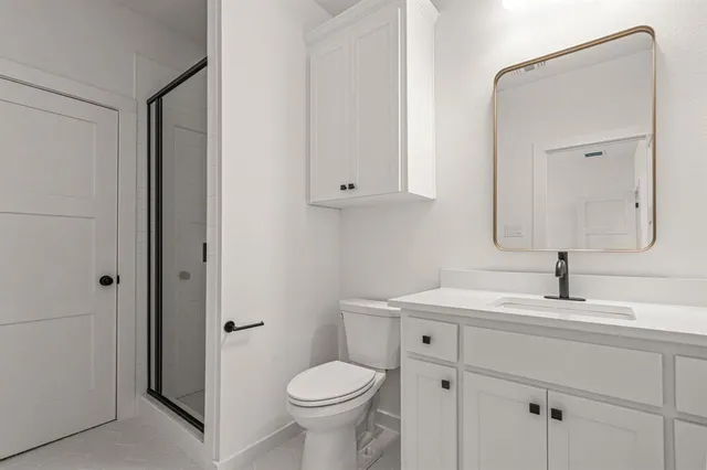 a bathroom with a sink toilet and vanity