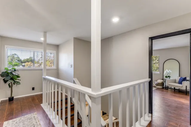 a kitchen with a sink stove top oven and cabinets