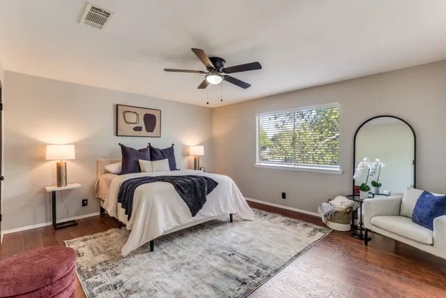 a view of a porch with wooden floor and windows