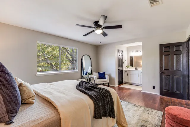 a bedroom with a bed and a couch