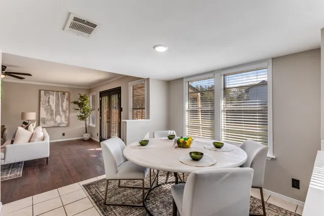a view of a dining room with furniture and window