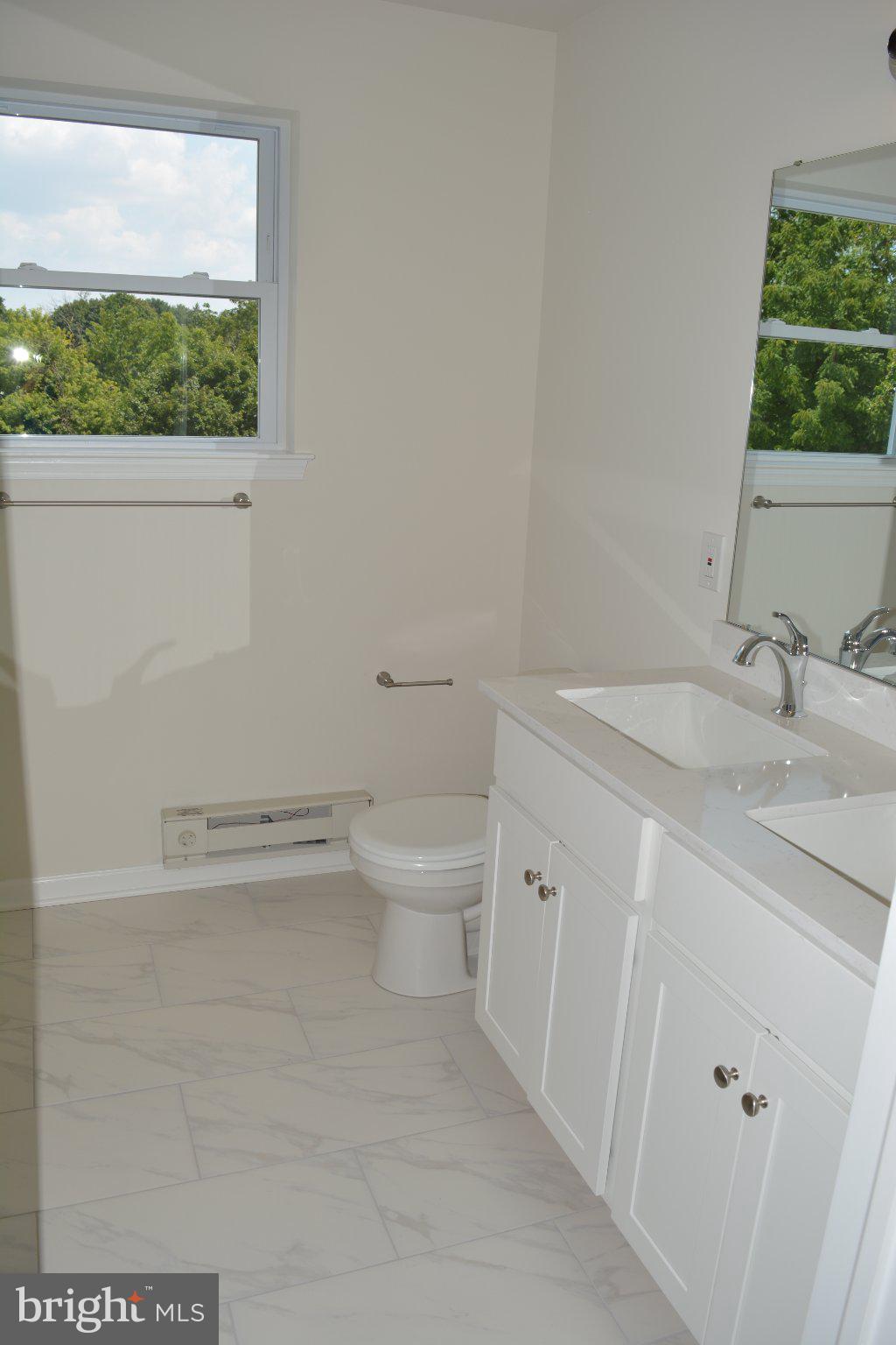 7631 Ridge Avenue, Unit 3 Philadelphia, PA 19128 - Photo 12 of 16 Bright and airy bathroom retreat.