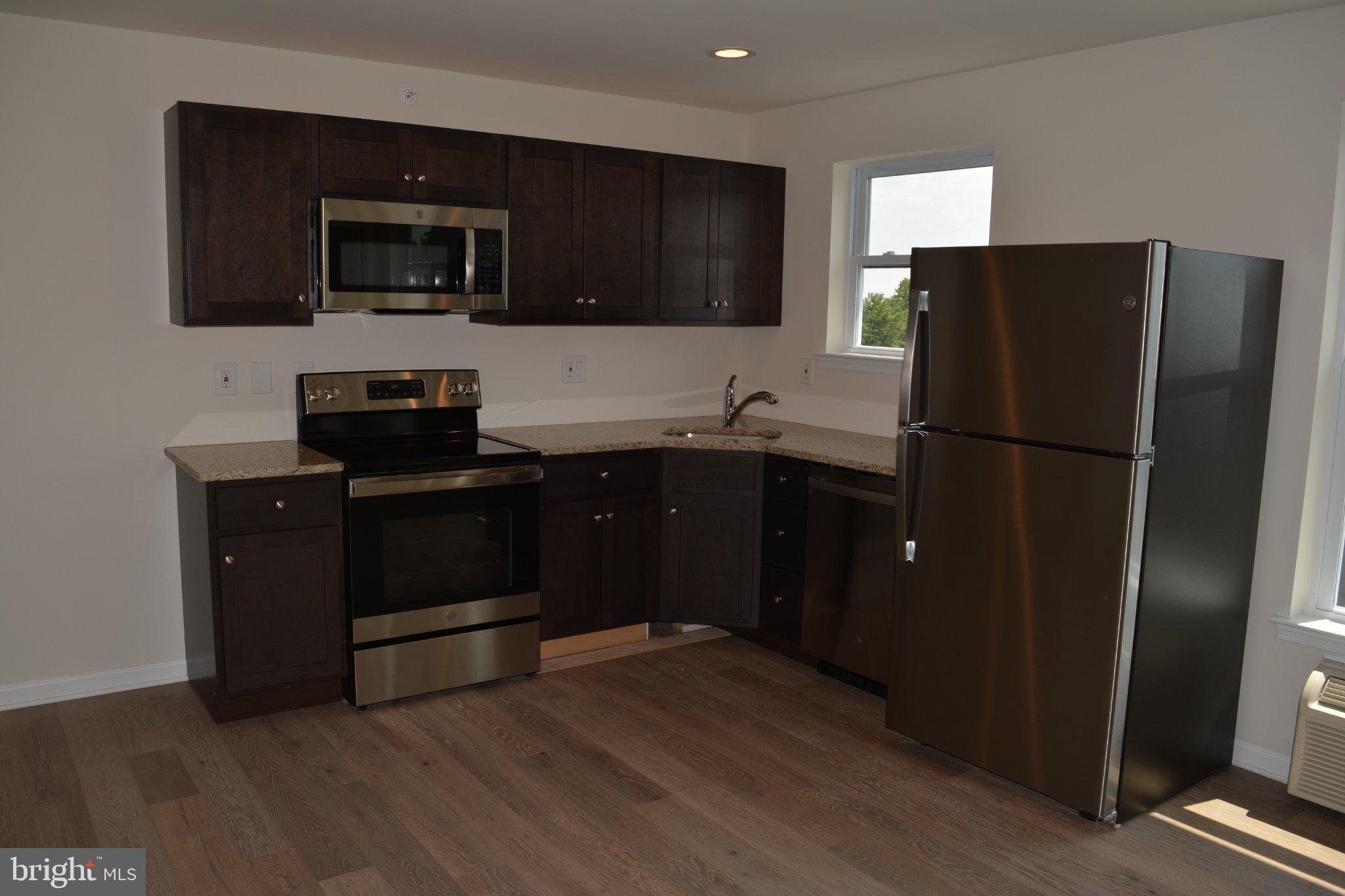 7631 Ridge Avenue, Unit 3 Philadelphia, PA 19128 - Photo 5 of 16 Modern kitchen with sleek finishes.