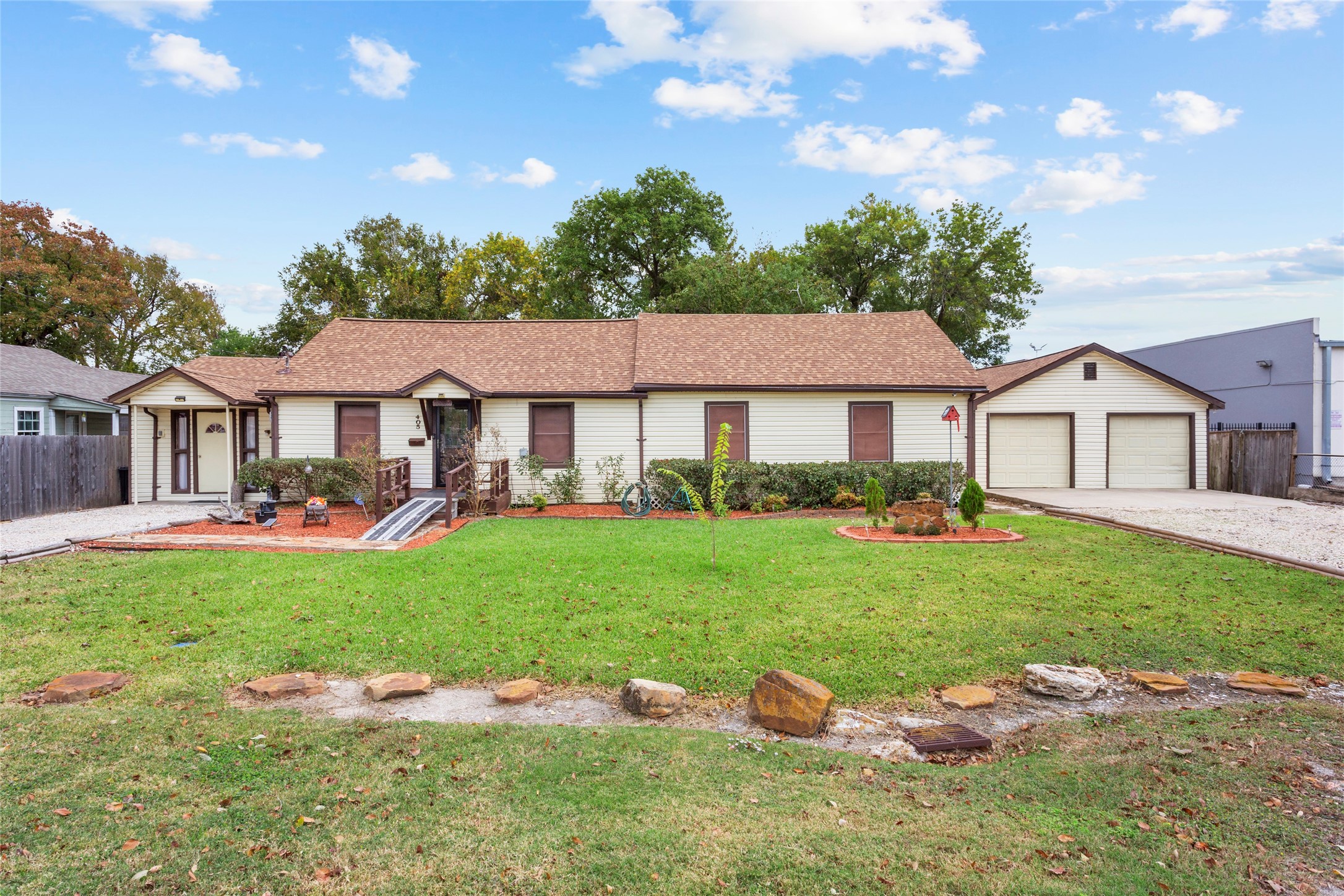 a front view of a house with garden
