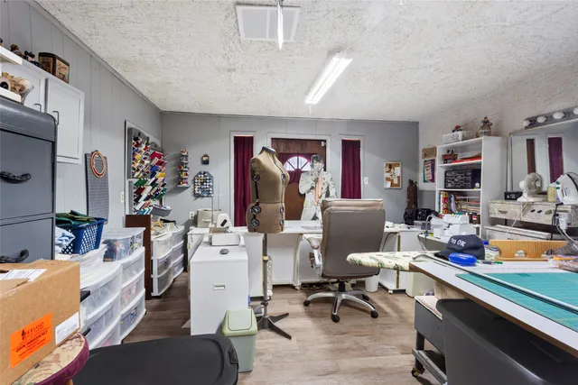 a view of a livingroom with workspace and a couch