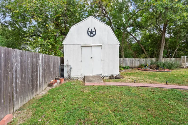 a view of back yard of house with green space