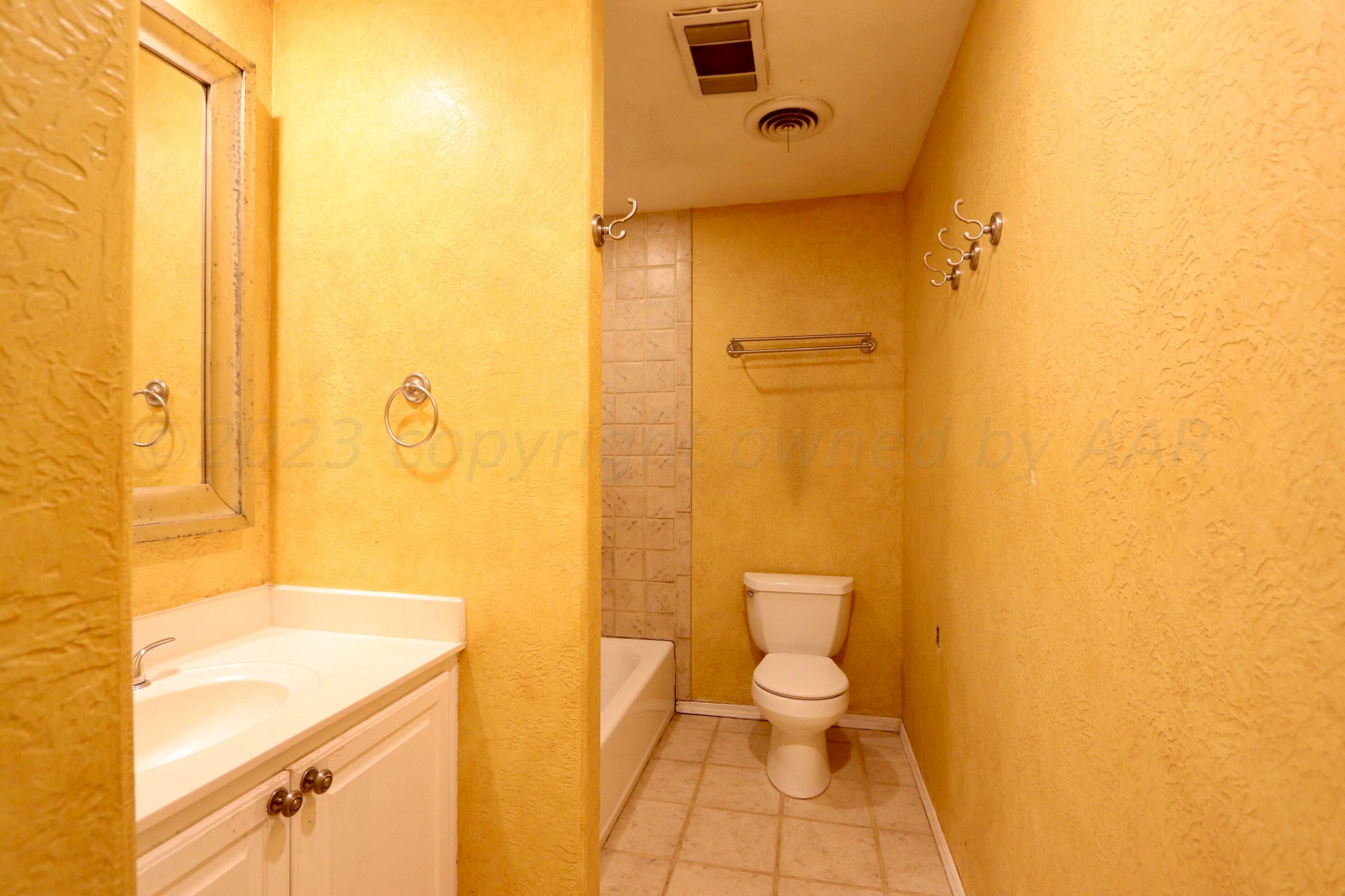 7916 Fenley Drive Amarillo, TX 79121 - Photo 11 of 23 a bathroom with a sink and a toilet