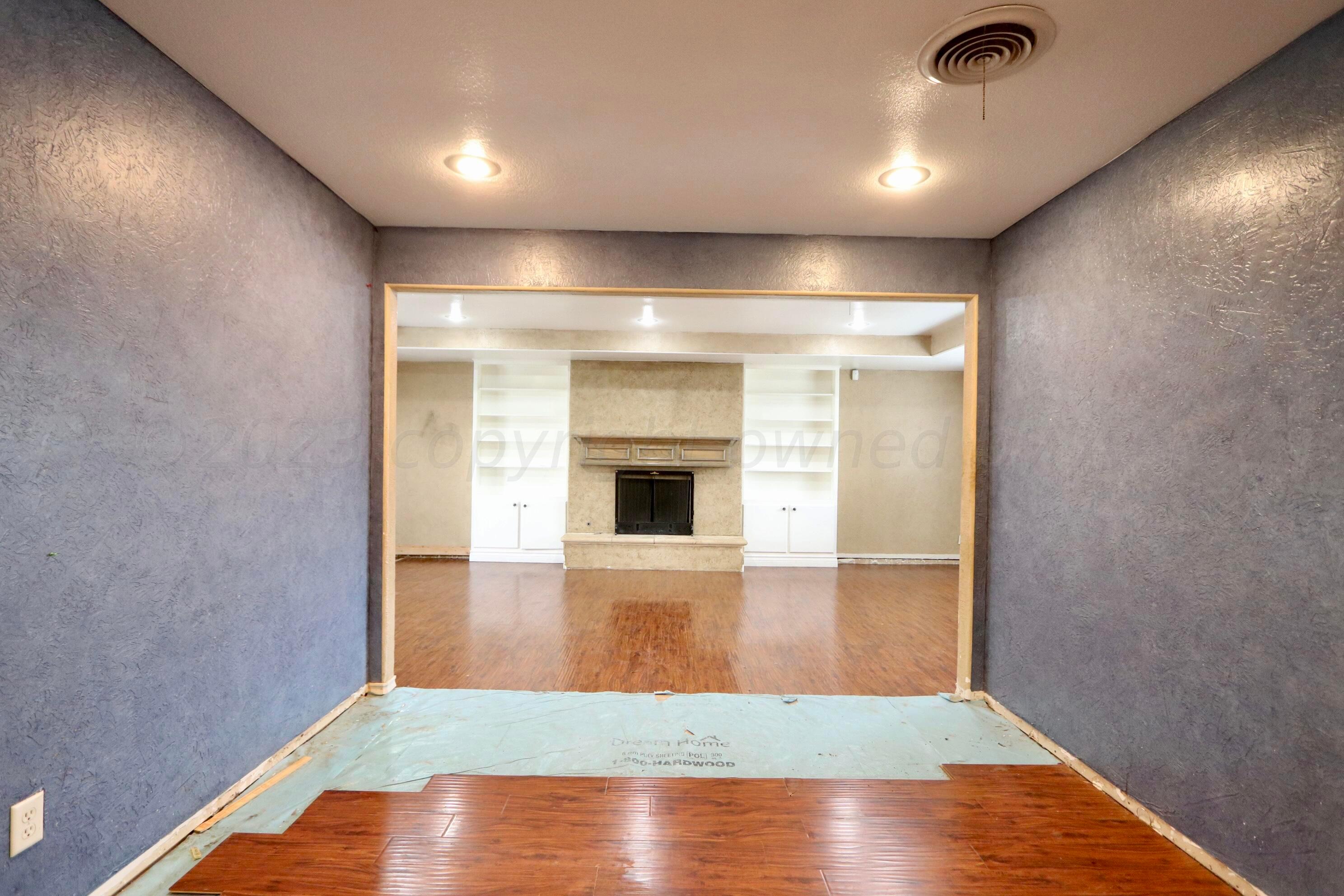 7916 Fenley Drive Amarillo, TX 79121 - Photo 7 of 23 a view of livingroom with wooden floor